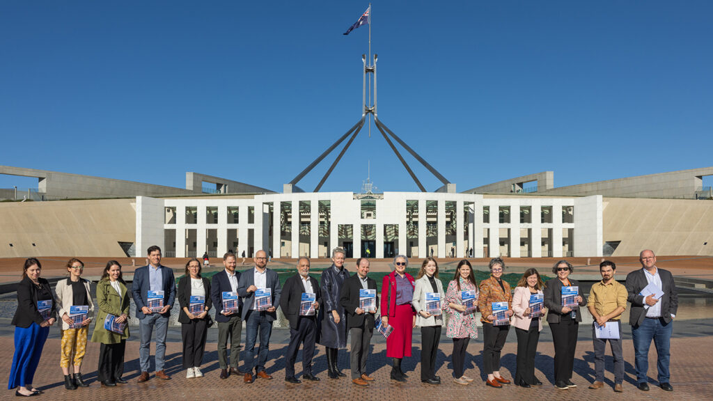 All-Electric Healthy Hospitals Report is launched in Canberra - representatives stand in front of Parliament House.